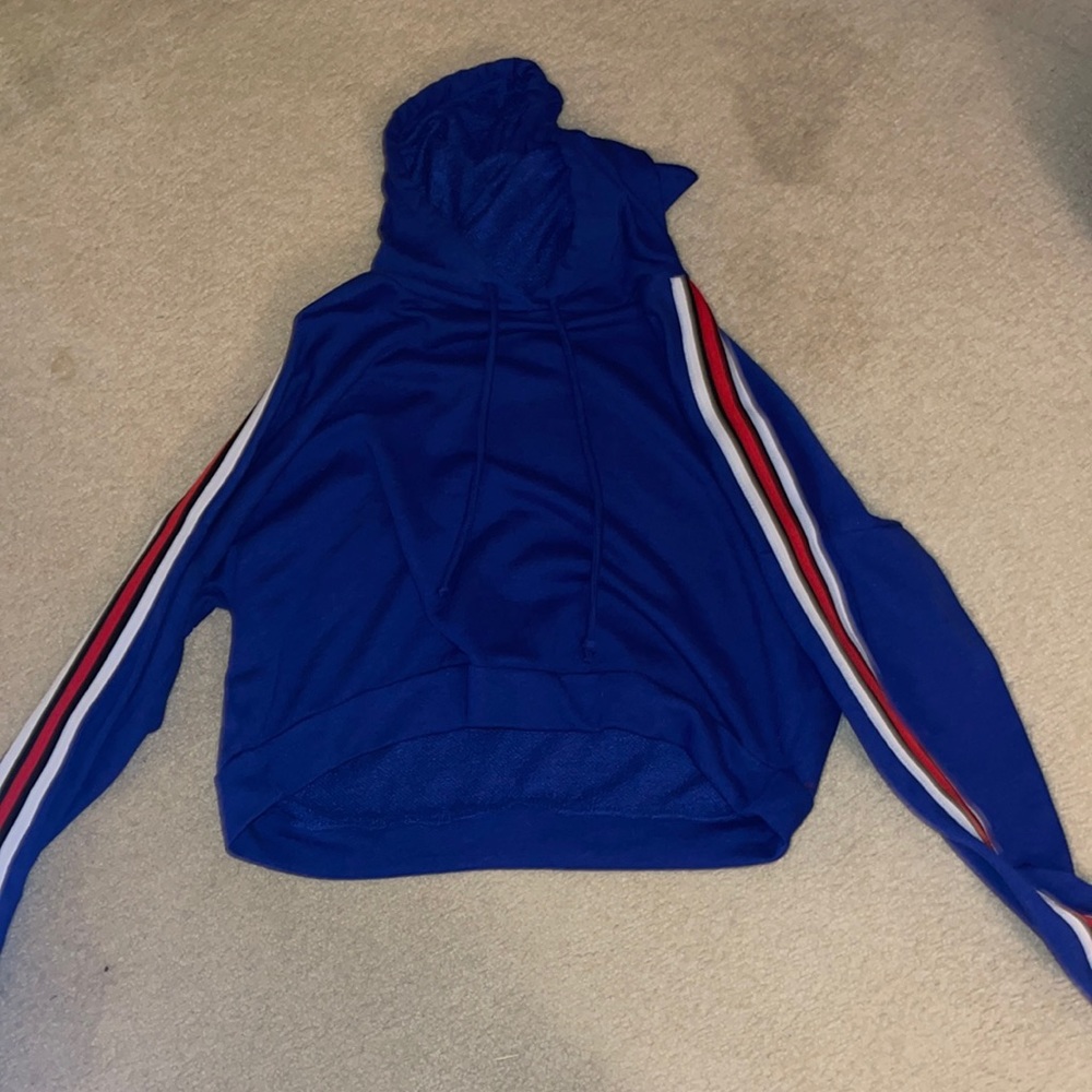 Blue crew neck size M with red and white stripes on both sleeves